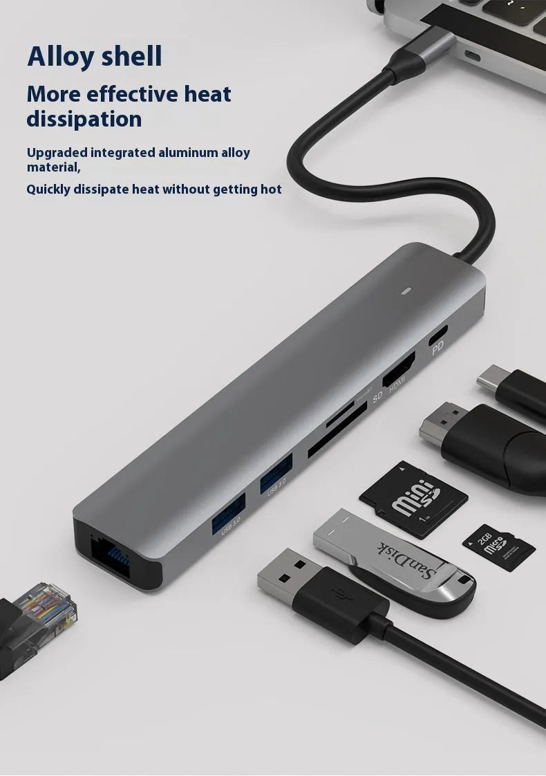 LQT-LH07 model 7-in-1 silver USB C hub showing USB-C plug, PD port, USB-A ports, and SD and microSD card slots.