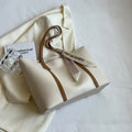 Large capacity bucket style tote bag with crossbody strap in multiple colour options
