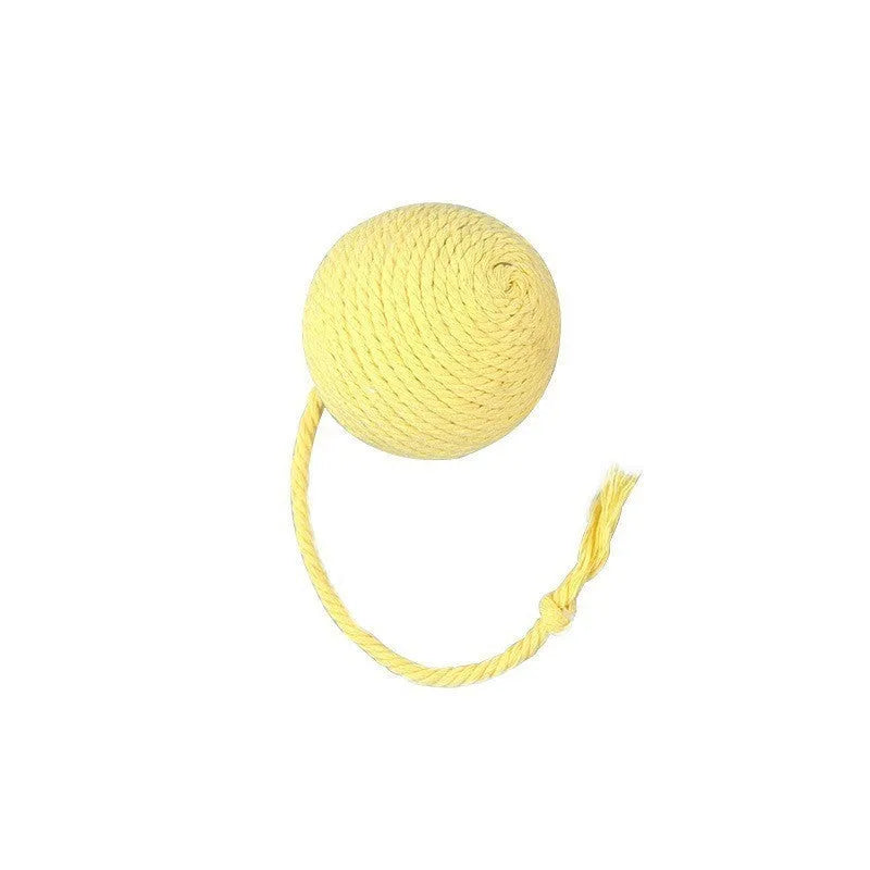 Green cat toy ball with attached rope and internal bell next to a pink one.
