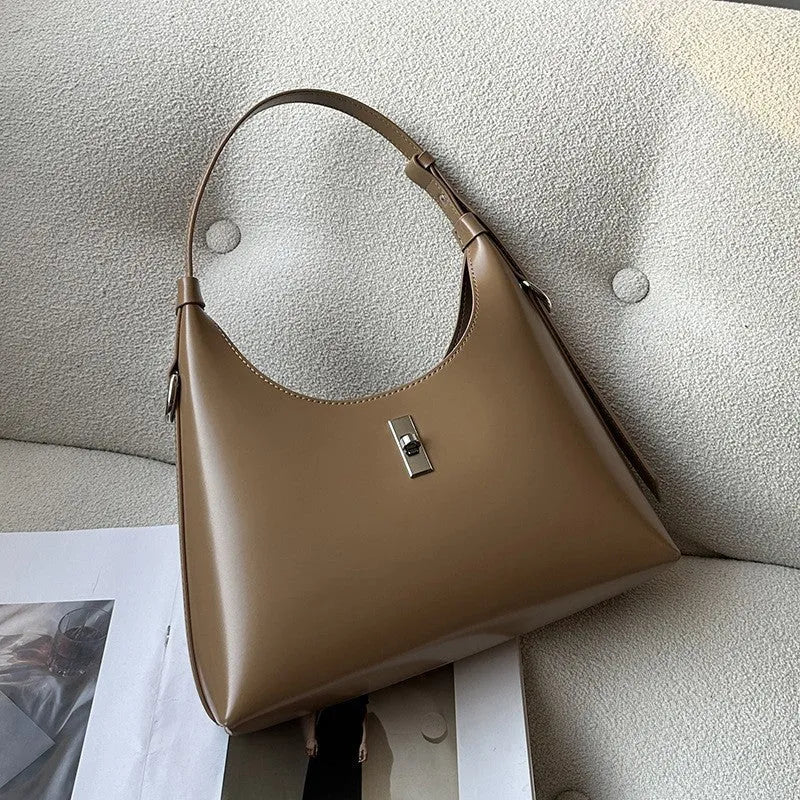 Soft genuine leather crossbody shoulder bag in a dumpling shape, shown in one of six available colours.