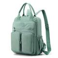 Waterproof nylon travel backpack in lotus root purple colour, showing multiple internal compartments and an external 3D pocket.