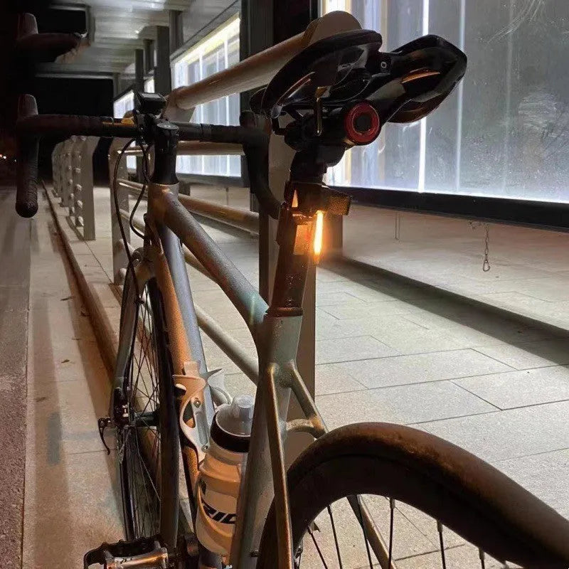 USB rechargeable waterproof bicycle rear light in yellow, red, blue, pink, or white colour options.