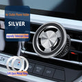 Silver magnetic car phone holder mounted on vehicle air vent