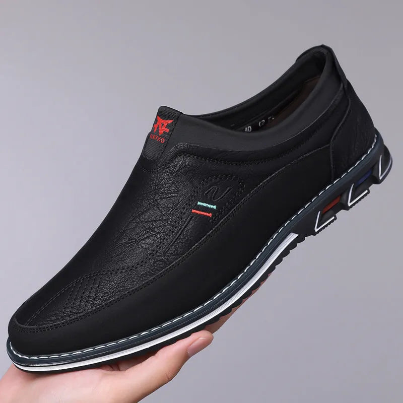 Men's black leather casual shoes with a low top, rubber sole, decorative stitching, and a leather toe cap.