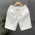 Men's black and white striped casual shorts with fleece lining and elastic waistband shown in straight cut design