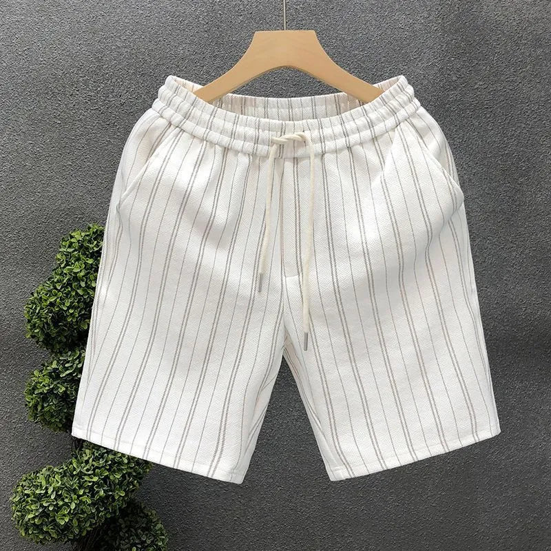 Men's black and white striped casual shorts with fleece lining and elastic waistband shown in straight cut design