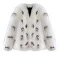 Black and white women's plus size short faux fur coat with regular sleeves on a model.