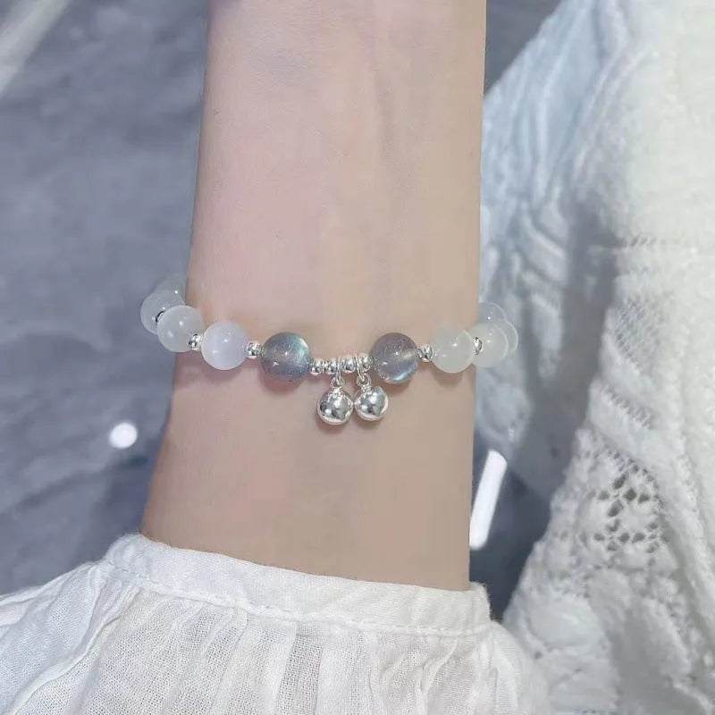 Chinese style glass bead bracelet with bamboo leaf design and manual craftsmanship details.