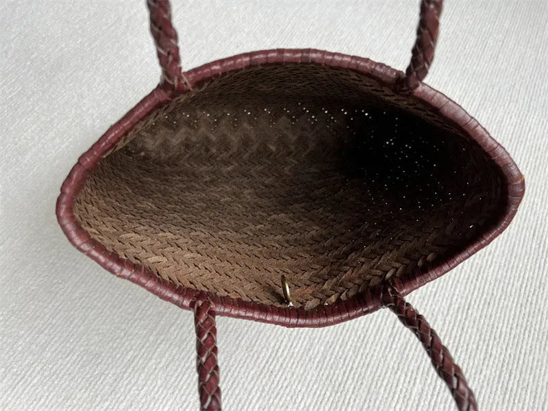 Brown handmade vintage woven leather tote bag with three-dimensional outer pockets.