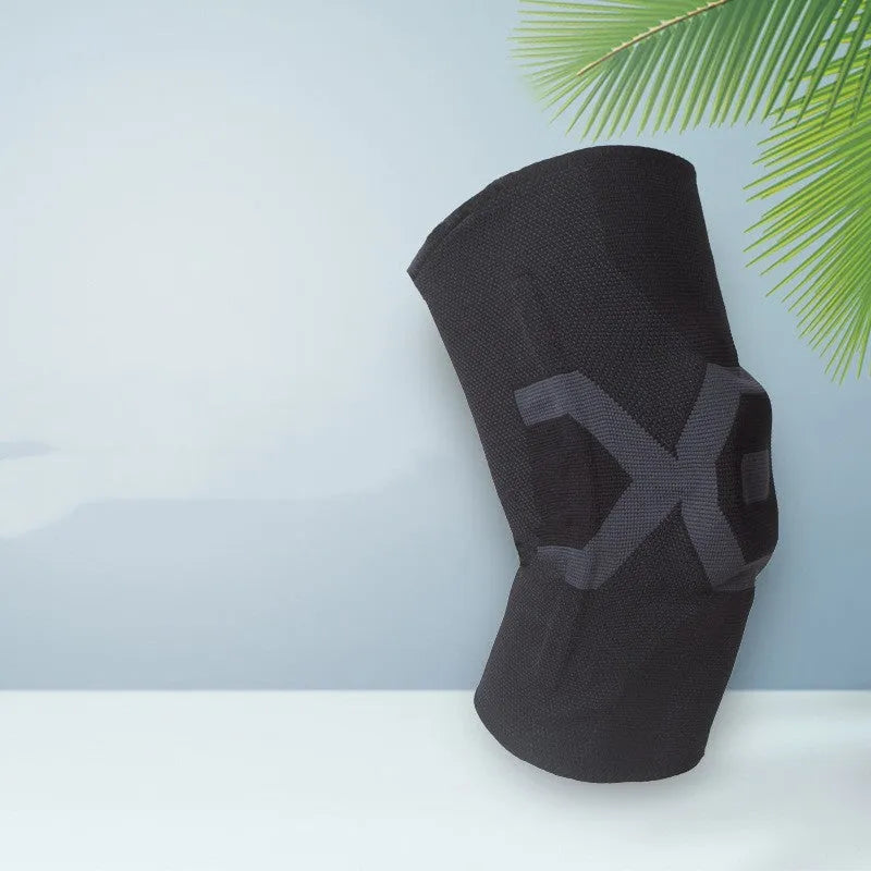 A pair of flexible silicone knee pads for sports, shown in a black and blue colour combination.
