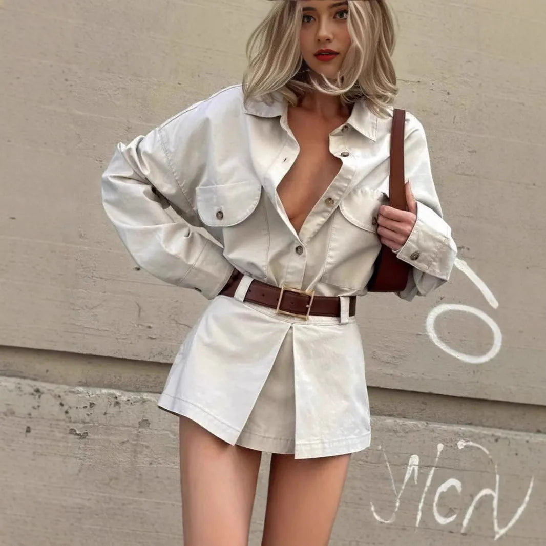 Grey long sleeve button front shirt dress with low waist and fake pocket details on a model