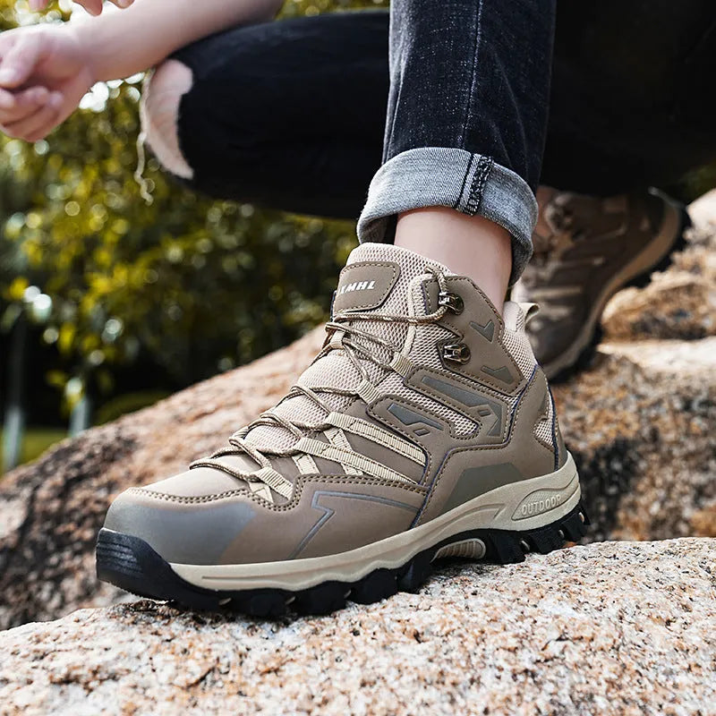 High-top outdoor hiking sneaker in flannel with rubber sole, shown on a rocky trail.
