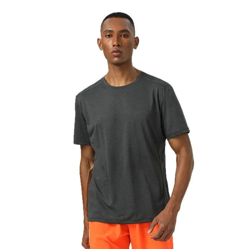 Adult short sleeve sports t-shirt in lightweight polyester, shown in dark grey, with reflective detail.
