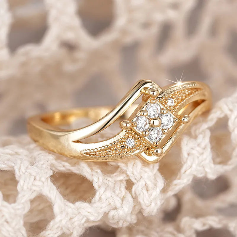 Yellow gold copper women's ring with diamond shape and micro inlaid zircon ornamentation.