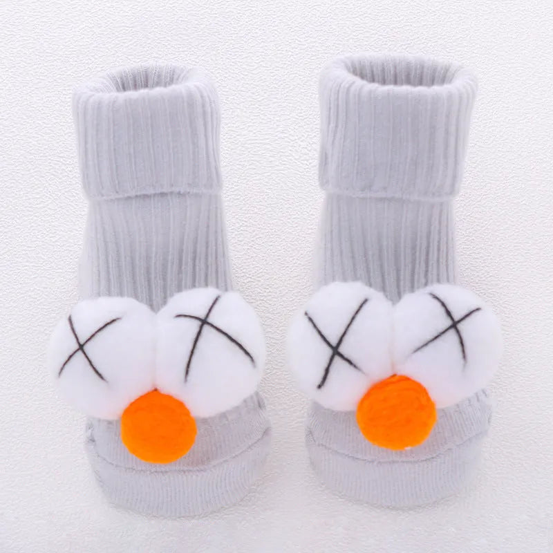 Cotton baby floor socks in various colours and patterns including bows, stars, and animal designs