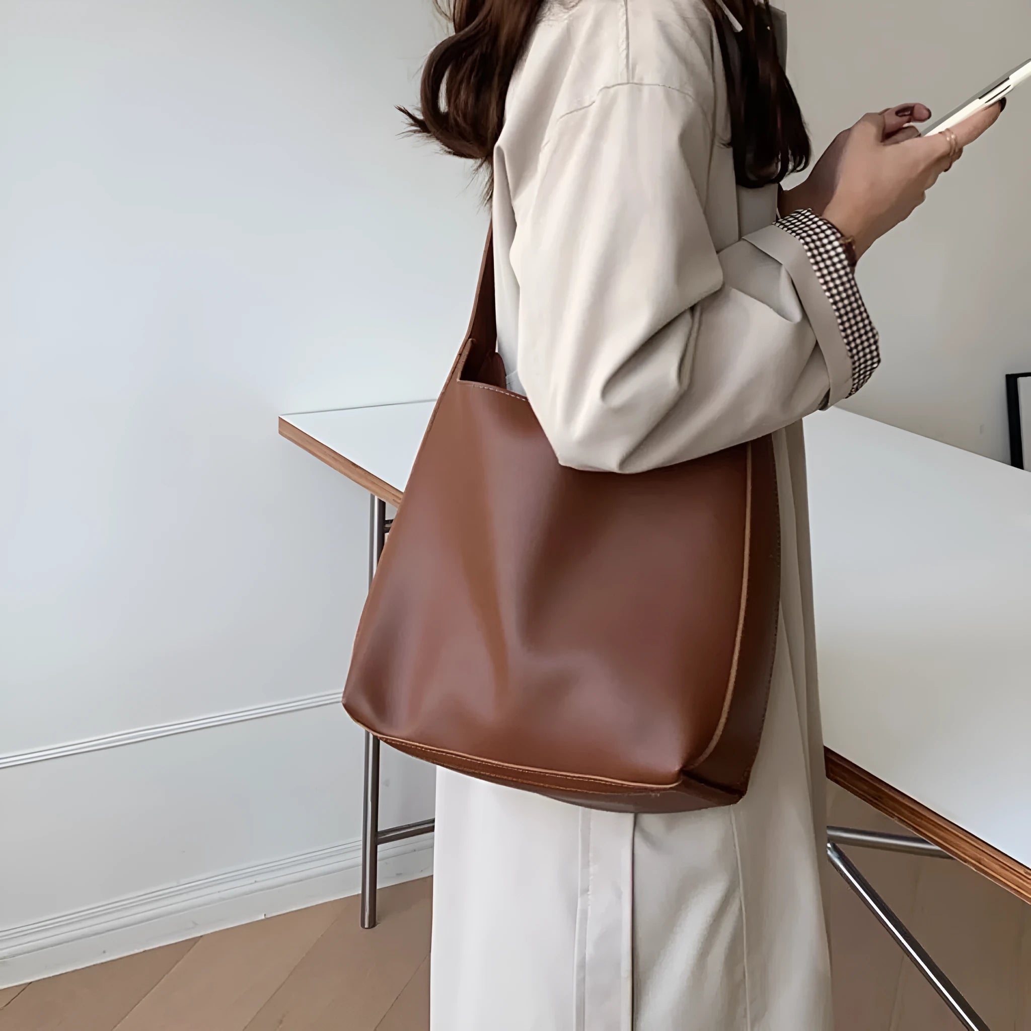 Ladies' shoulder bag with swing thread details in soft PU material showing black and brown colour options
