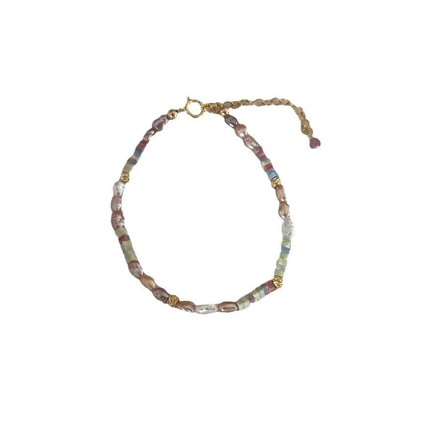 Women's 14K gilded purple silver bracelet with irregular natural pearls and matching necklace.