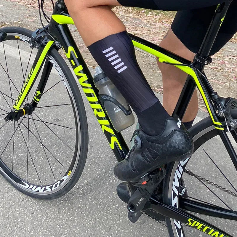 Adult unisex cycling and running socks in orange, black, purple, white, grey, and dark blue colours