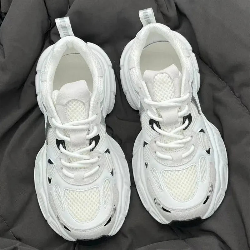 Beige mesh platform sports shoes with a wedge heel and lace-up front.