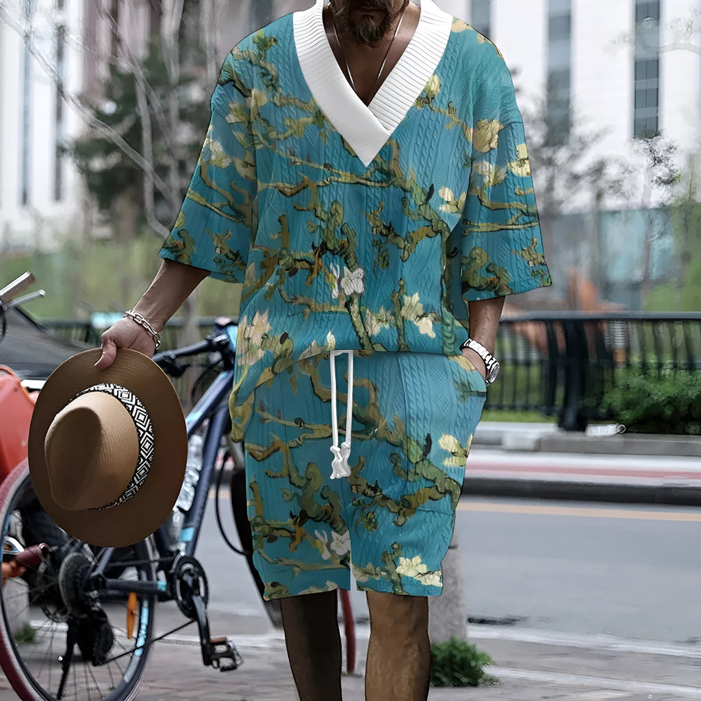 Peacock blue men's 3D printed knitted casual suit with T-shirt top and matching shorts.