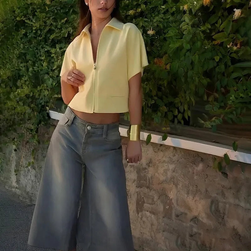 Loose-fit short sleeve casual top in white, shown on a model.