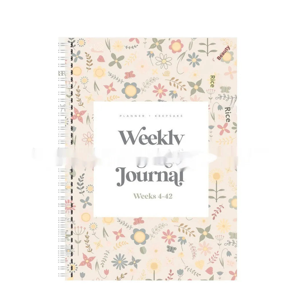 A5 pregnancy weekly diary notebook open showing weekly pregnancy journal pages