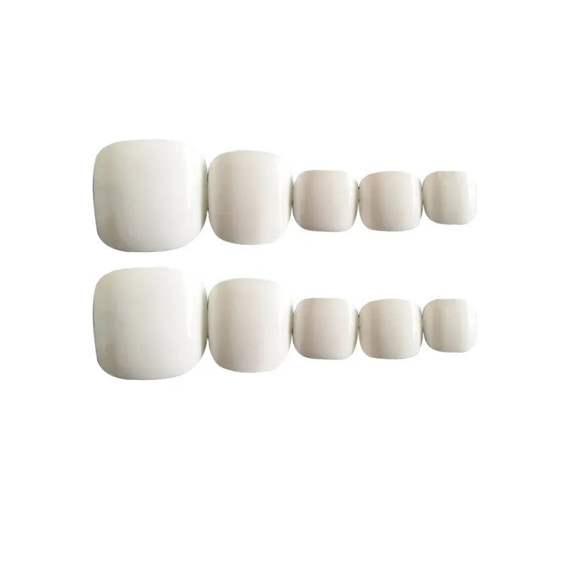 Set of white press-on artificial nails with a starry sky pattern.
