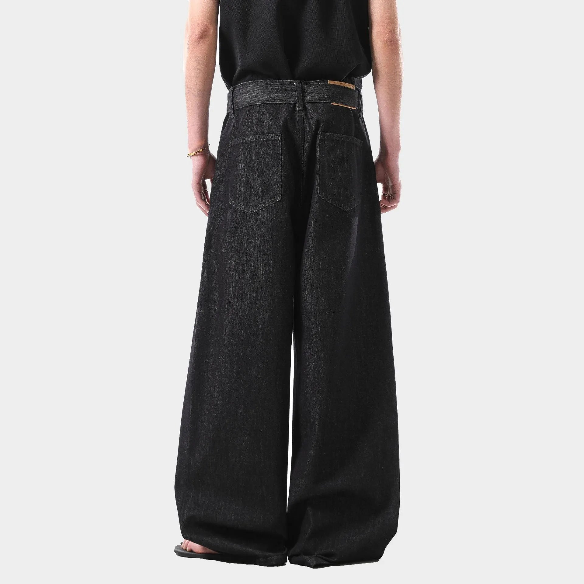 Black women's high-waist straight leg jeans with a zip fly, shown in an American retro style.