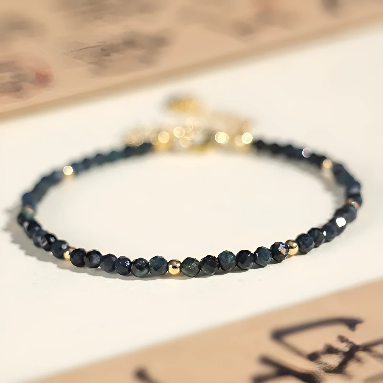 Blue tourmaline bracelet with 3mm cut beads and spacer bead design for women