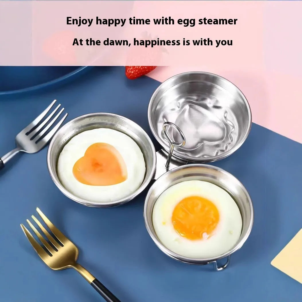 A small stainless steel egg steamer in a heart shape next to a round version, for cooking eggs on a hob.