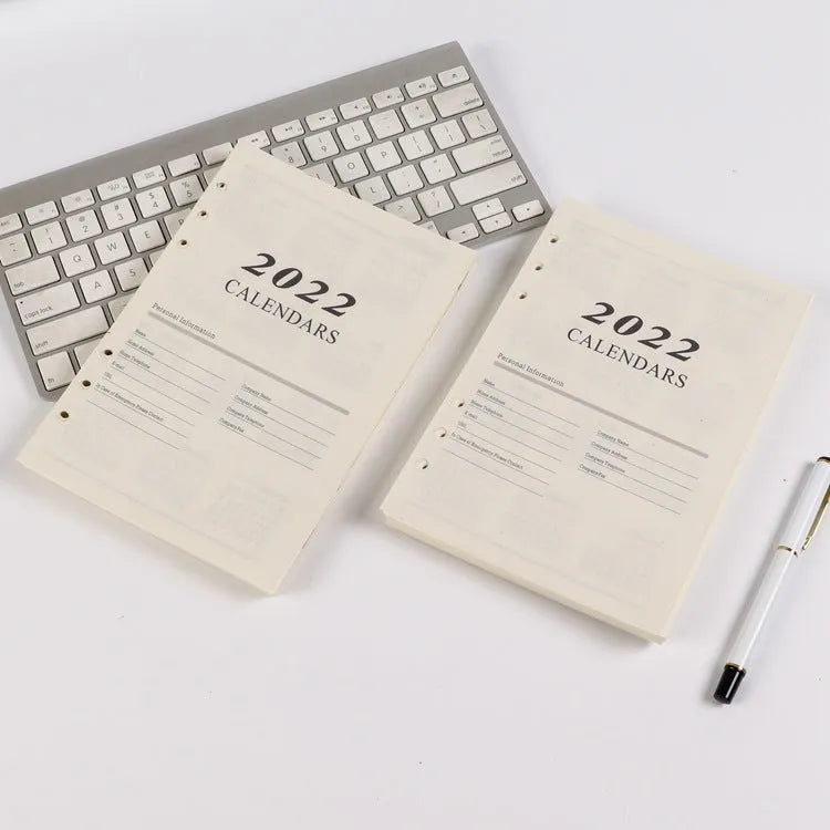 A5 loose-leaf notebook inner pages with monthly plan layout on white paper