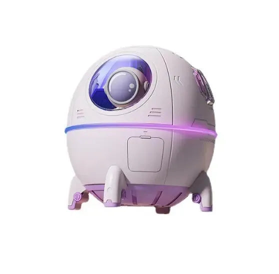 Light purple astronaut-shaped desktop USB humidifier with LED lights on a desk
