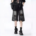Men's loose fit distressed denim shorts in black vintage style with ripped detailing