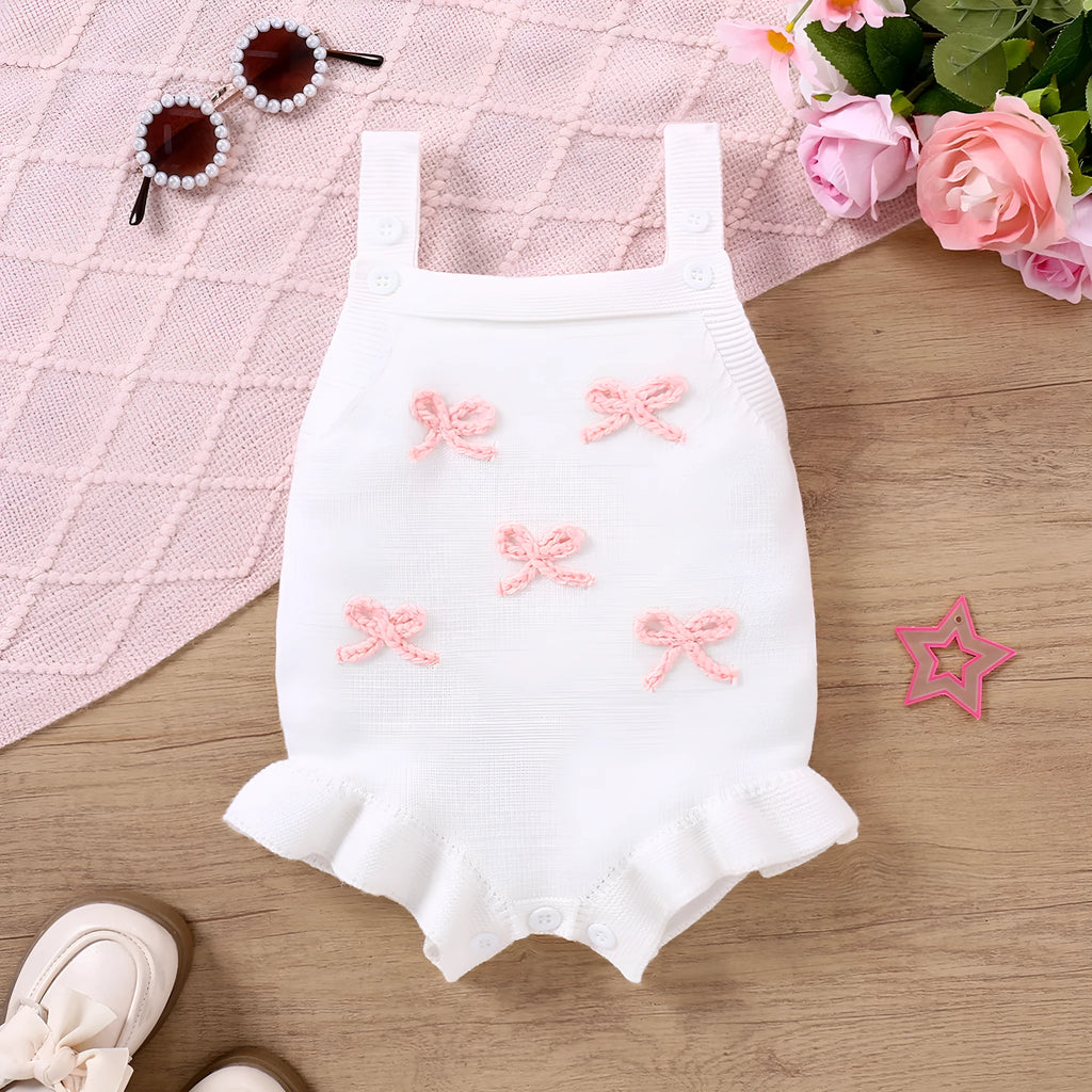 Baby sling-style wool blend romper with bow embroidery, in white or pink, sizes 0-3M to 12-18M