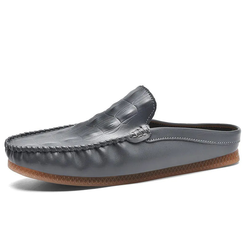 Men's black Gommino-style leisure semi-slippers with artificial PU upper and rubber sole on a white background.