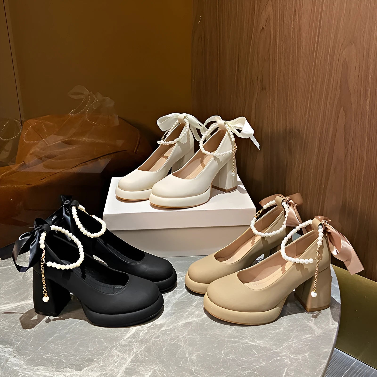 Women's beige Mary Jane shoes with chunky heel and ankle strap buckle showing round toe design