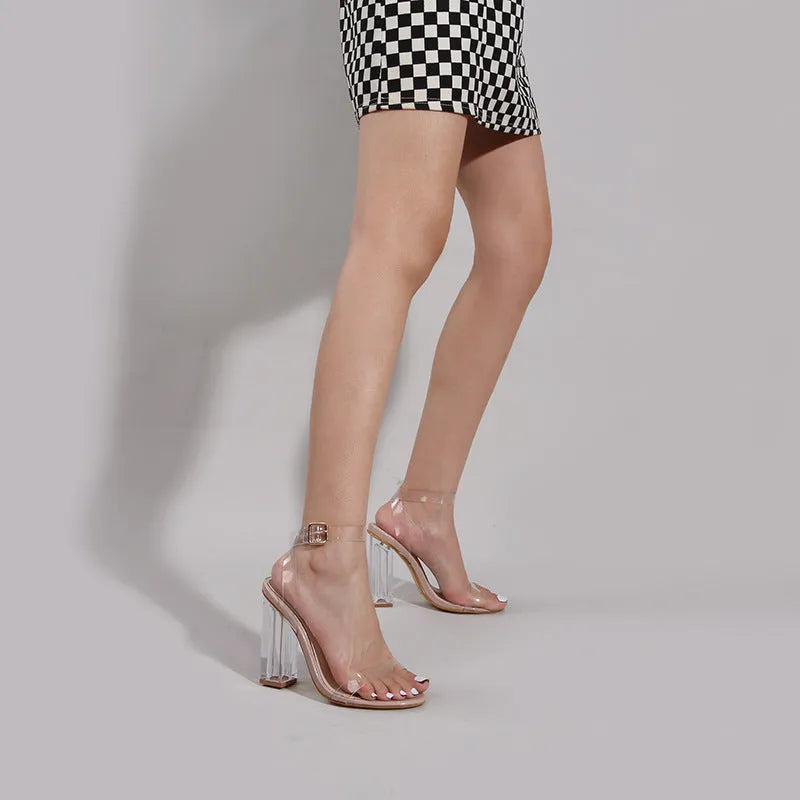 Apricot women's sandals with transparent glass heel and buckle closure.