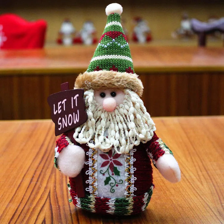 Set of three flannel Christmas decorations: snowman, elk, and old man figures in red, green, and white