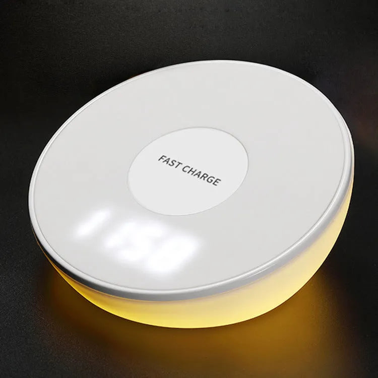 White wireless phone charger with clock display and control buttons on front