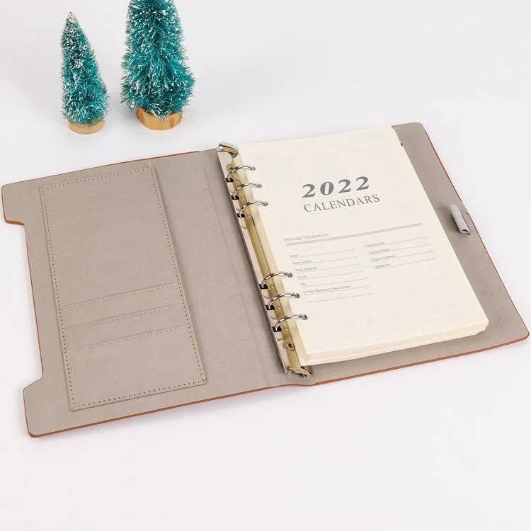 A5 loose-leaf notebook inner pages with monthly plan layout on white paper