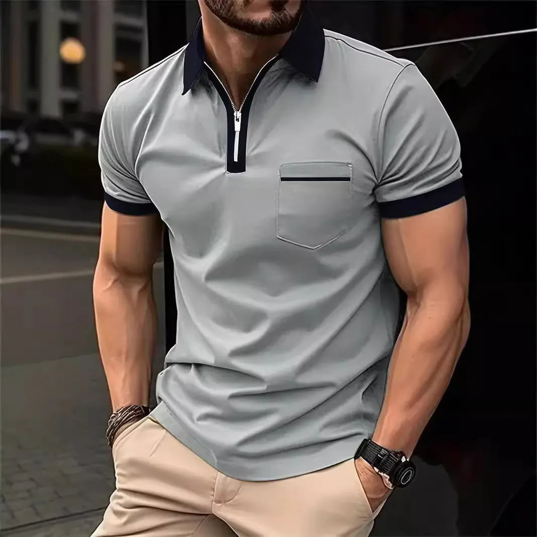 Man wearing a loose-fit casual short-sleeved shirt with a chest pocket and zipper decoration details.