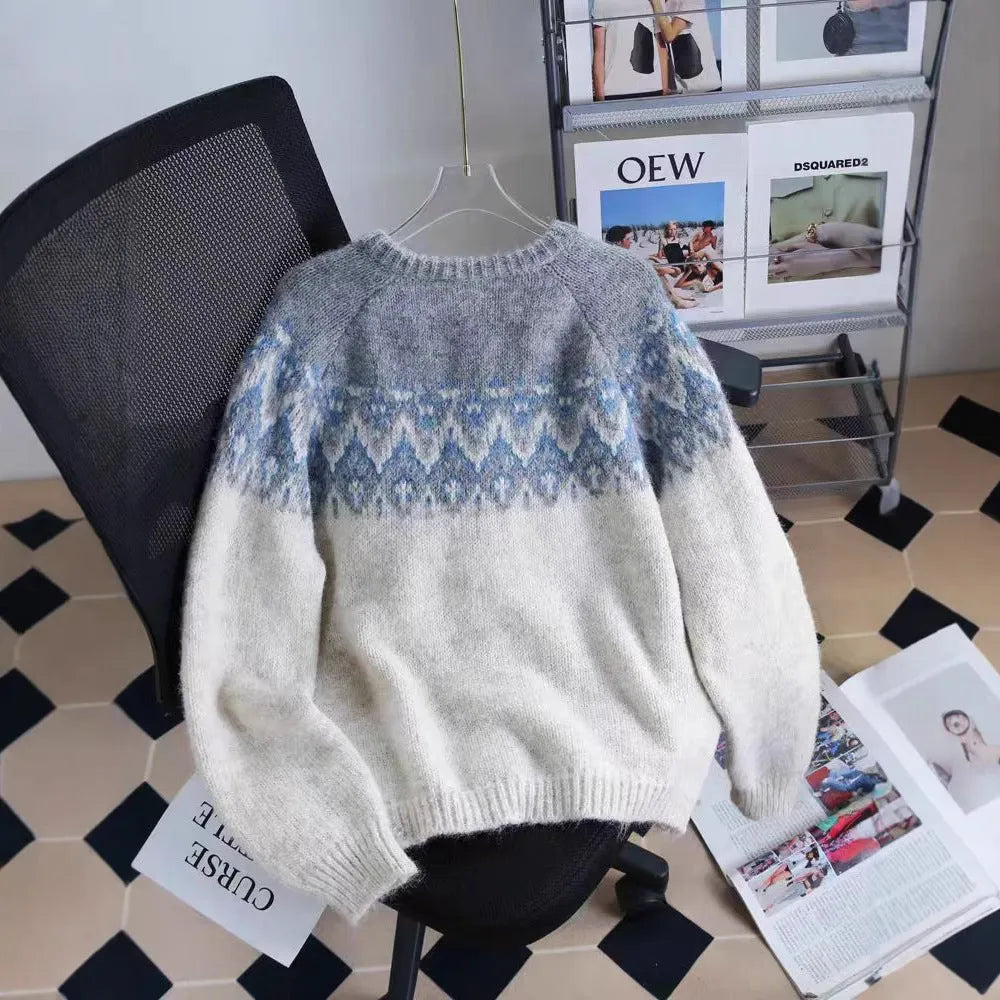 Women's loose-fit jacquard knit sweater coat in milky white, shown on a hanger.