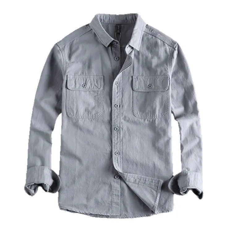 Man wearing a loose fit long sleeve cardigan shirt in light grey polyester.