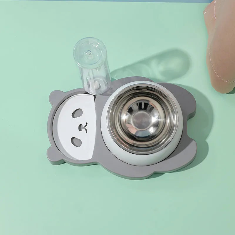 Grey panda-shaped raised pet feeder with tilted stainless steel bowls and a water bottle on a white background.