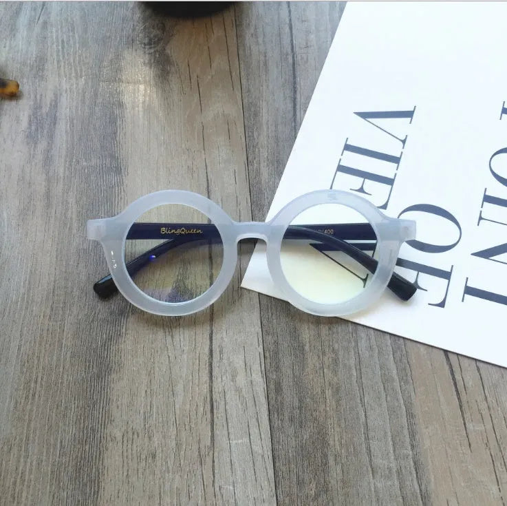 Retro round glasses with plastic frames in leopard print colour and clear lenses.