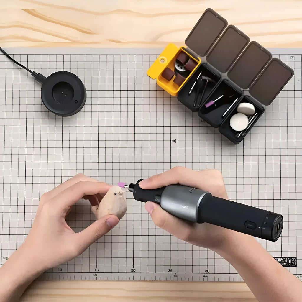 Black hand held rechargeable grinder with USB charging, 3.6V lithium ion battery, and 24-piece accessory set for cutting and polishing.
