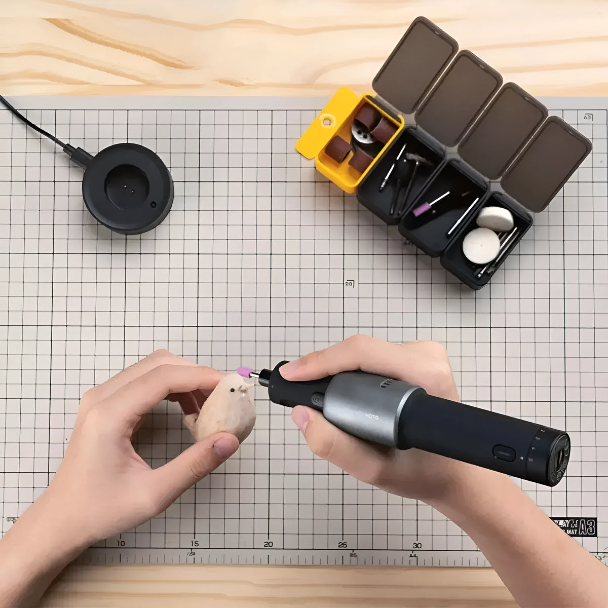 Black hand held rechargeable grinder with USB charging, 3.6V lithium ion battery, and 24-piece accessory set for cutting and polishing.