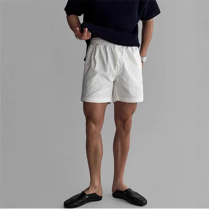 Loose-fit cotton sports shorts in black colour shown on model