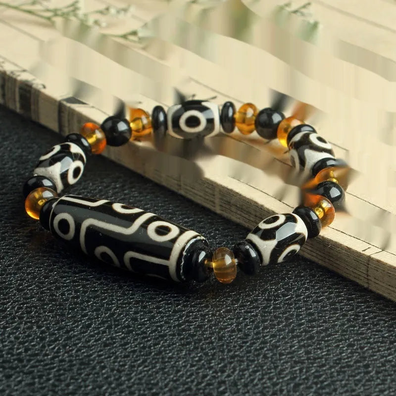 Distressed agate Tibet beads bracelet with three eye dzi design and polished stone beads