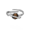 Saturn Tigereye adjustable silver ring with white gold electroplated finish and open design